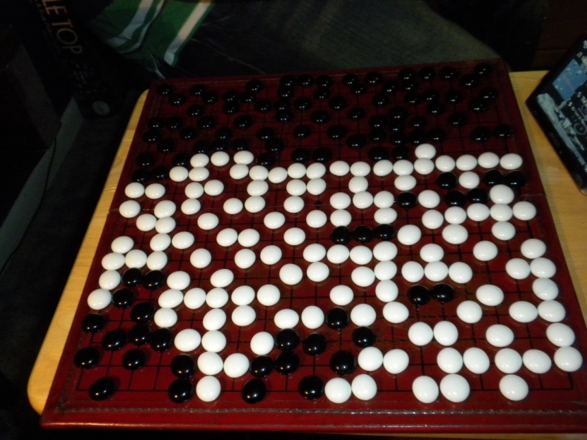 This is how our second game ended. I was practically forced to fill in all of my territory to prevent loss due to these questionable tactics.