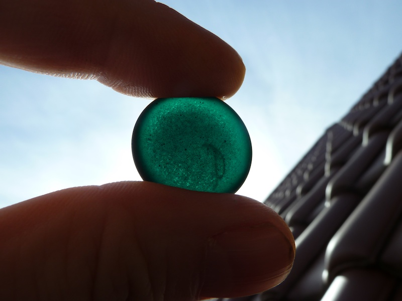 Black stone held against the sun